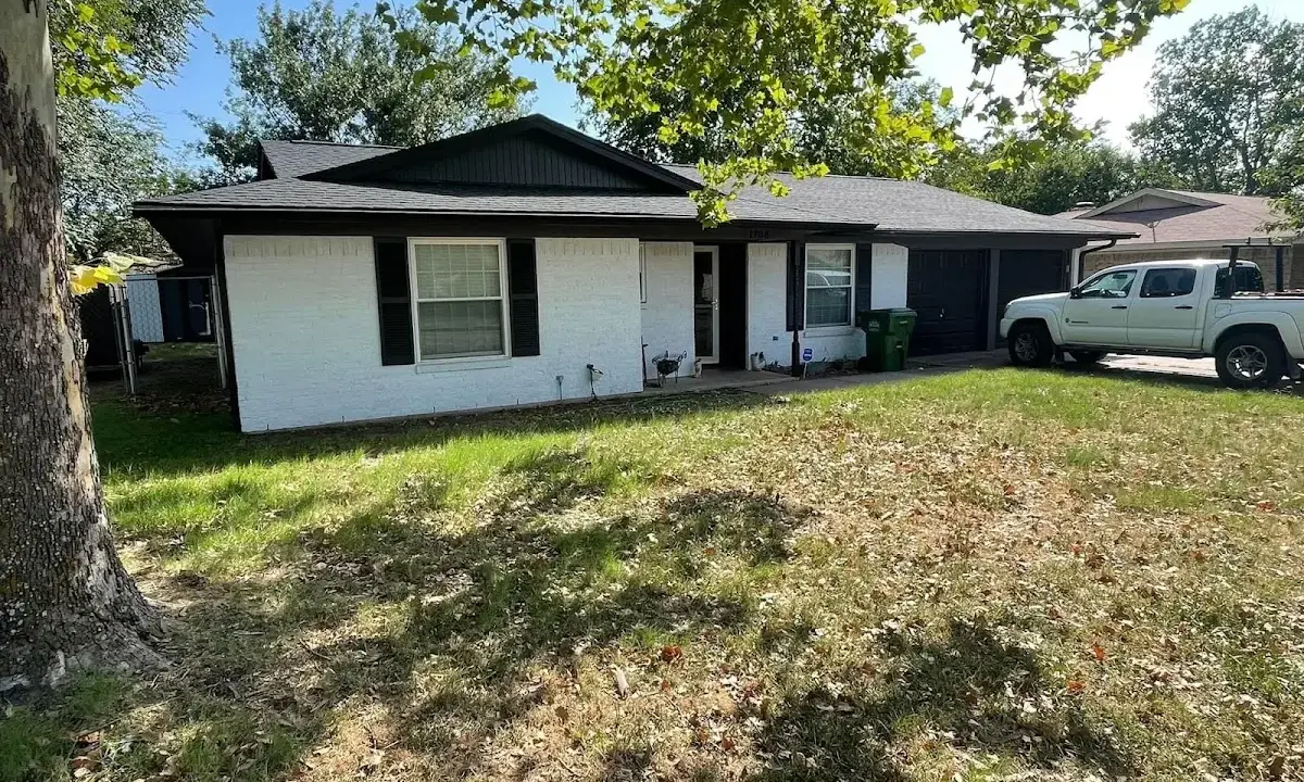 Professional roofing crew working on a residential roof in Town of Pecos